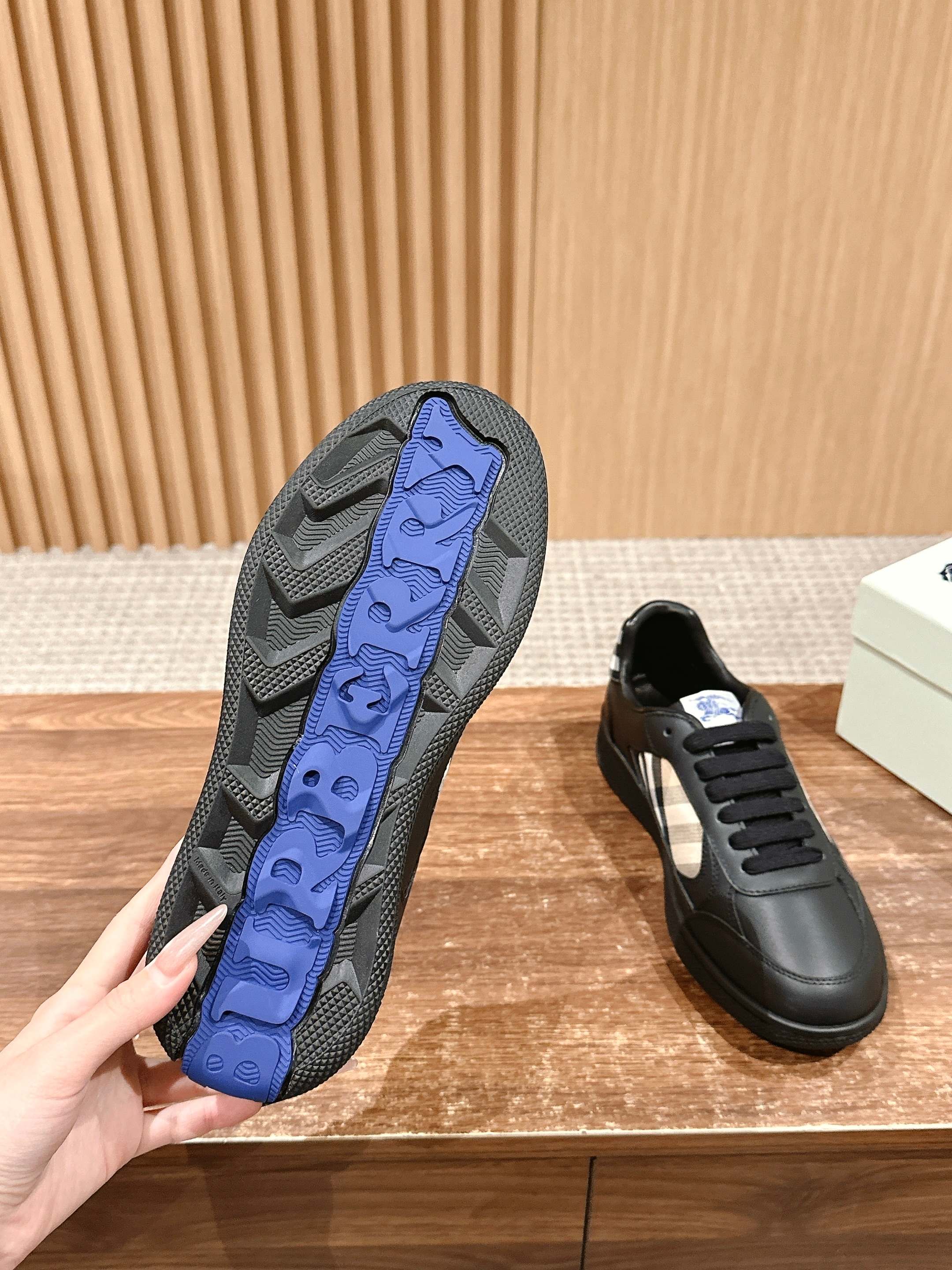 Burberry sneaker outsole with blue tread and deep rubber grooves