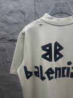 Balenciaga short-sleeve T-shirt with back logo graphic and stud detail at shoulders