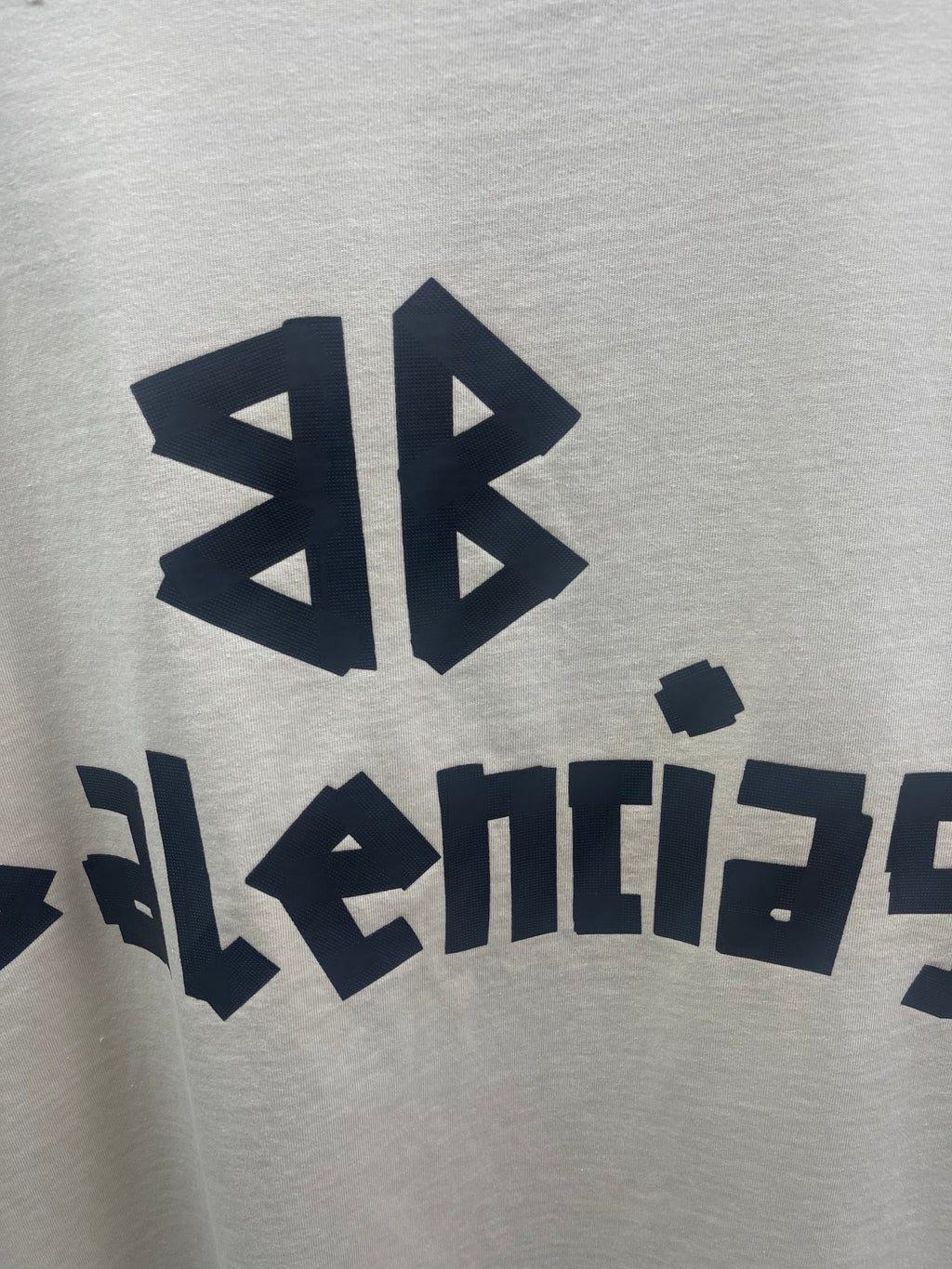 Balenciaga short-sleeve T-shirt close-up of logo symbols and lettering print