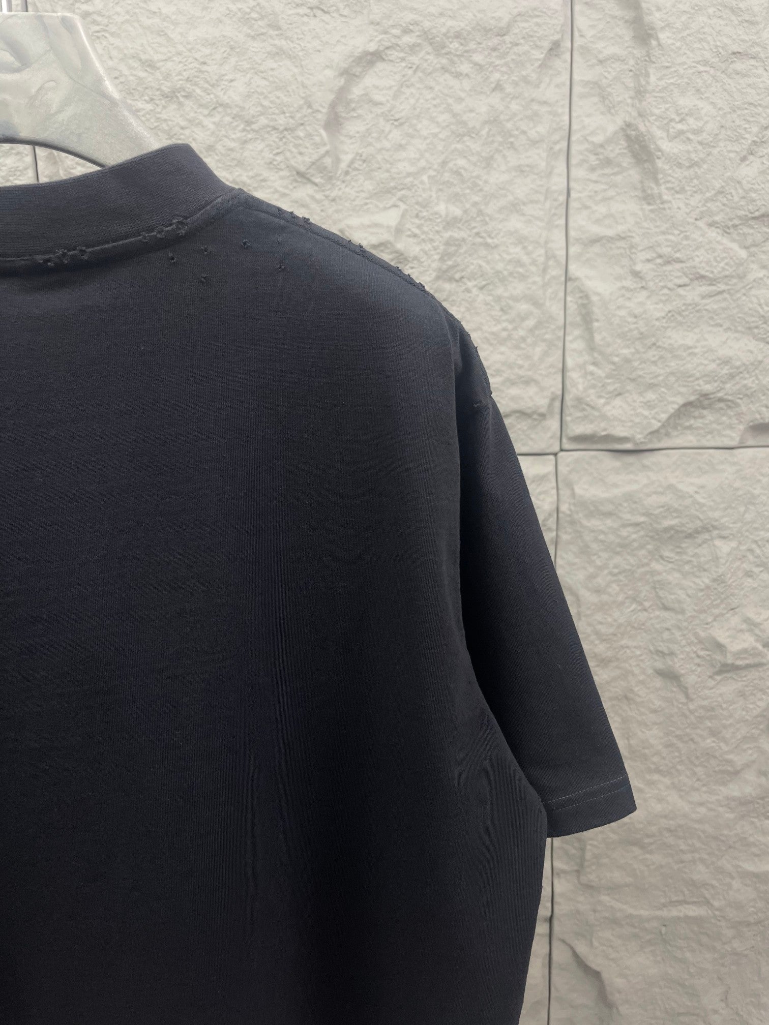 Balenciaga navy short-sleeve T-shirt side view, smooth fabric