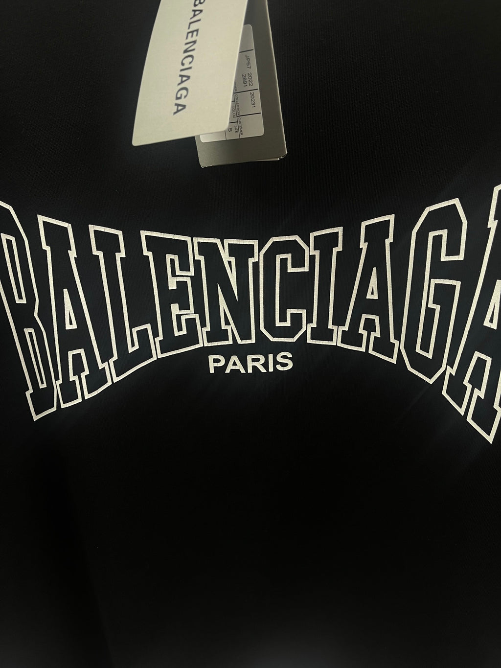 Black Balenciaga T-shirt close-up of large front logo and Paris text