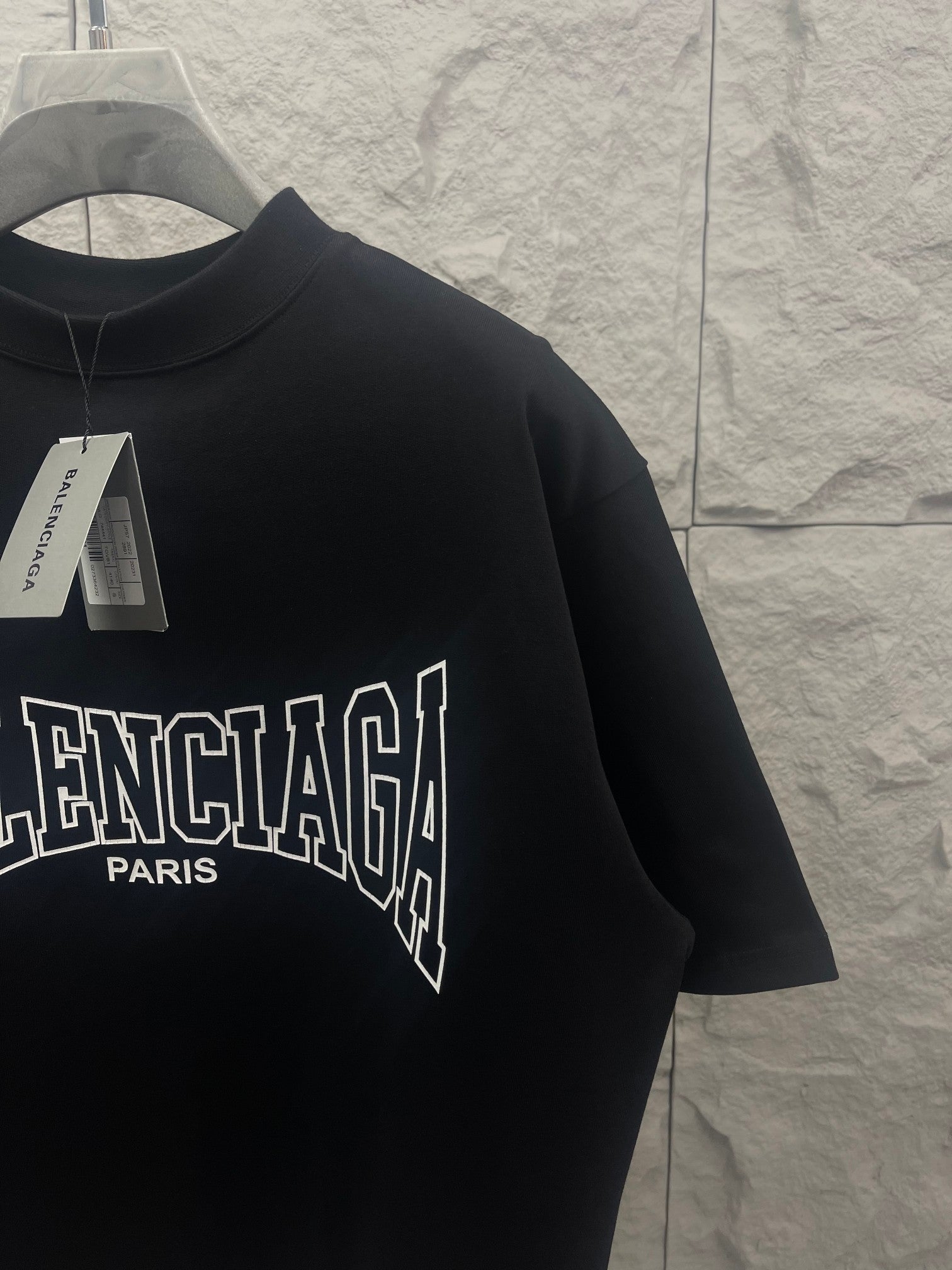 Black Balenciaga T-shirt close-up of front logo and collar tag