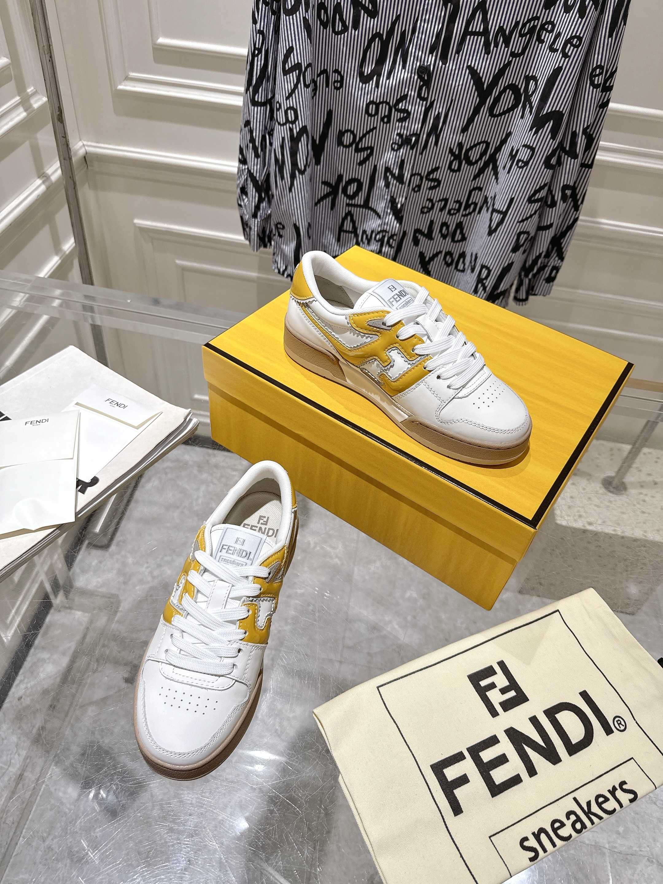 Fendi white leather sneakers with yellow accents and tan sole, lace-up