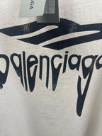 White Balenciaga T-shirt fabric close-up with large logo lettering