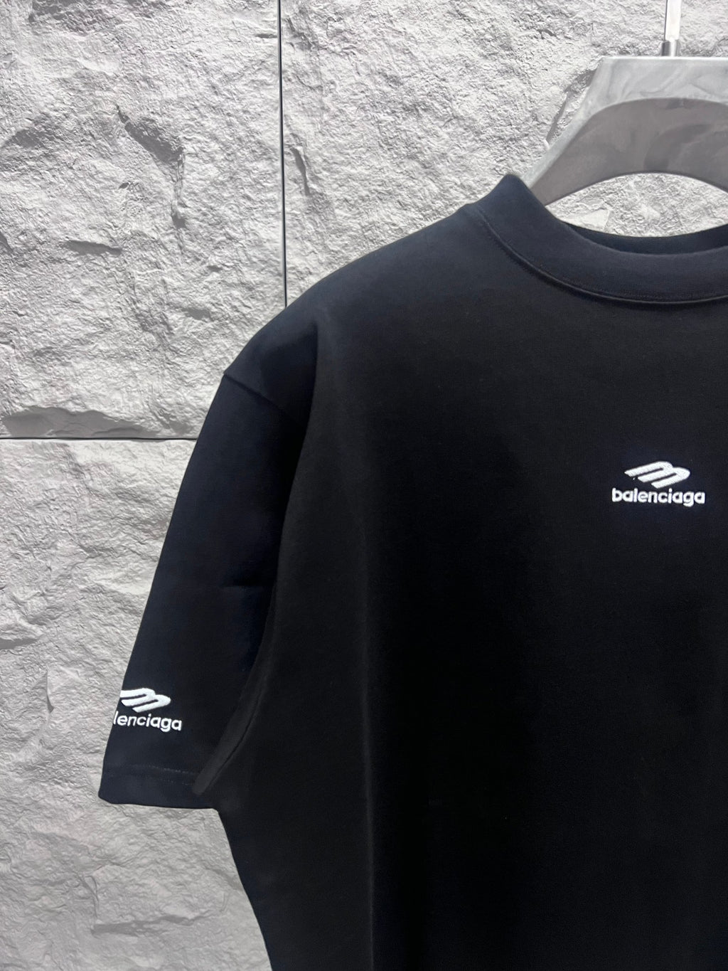 Black short-sleeve T-shirt with Balenciaga logo on front sleeve
