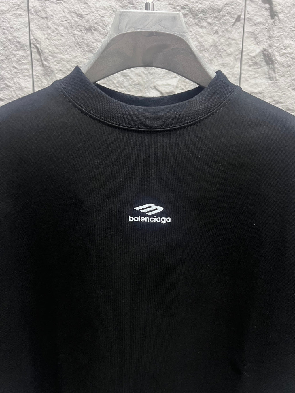 Black short-sleeve T-shirt with round crew neck and Balenciaga logo at chest