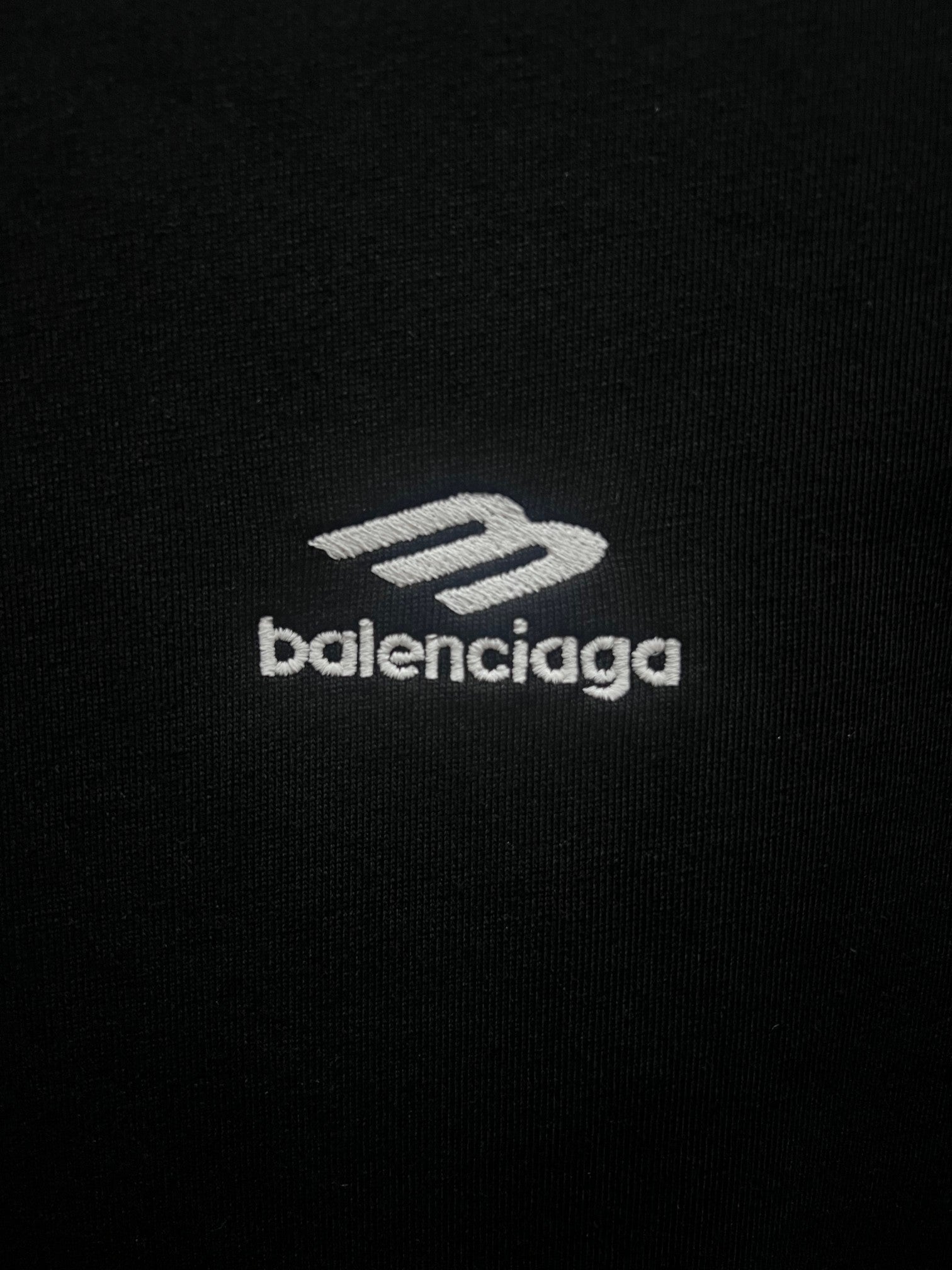 Black T-shirt with white balenciaga logo on chest