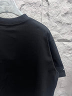 Black short-sleeve T-shirt with partial Balenciaga logo on sleeve