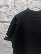 Black short-sleeve T-shirt with sleeve logo, angled view