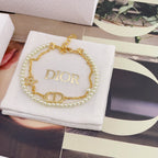 Gold and pearl charm bracelet with DIOR pendant, star detail and clasp