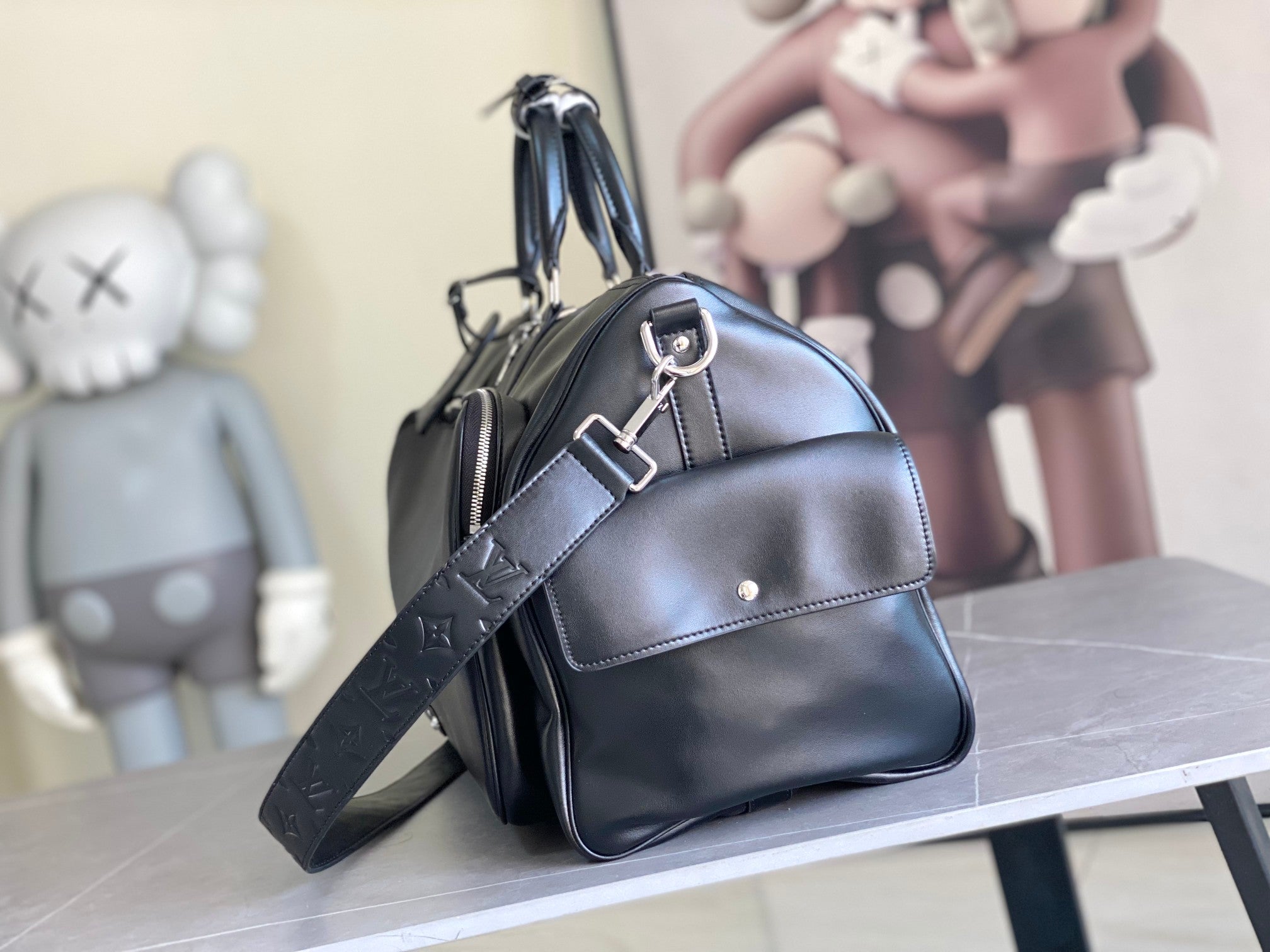 Louis Vuitton men's duffel bag with crossbody strap and zipped top, dark blue leather