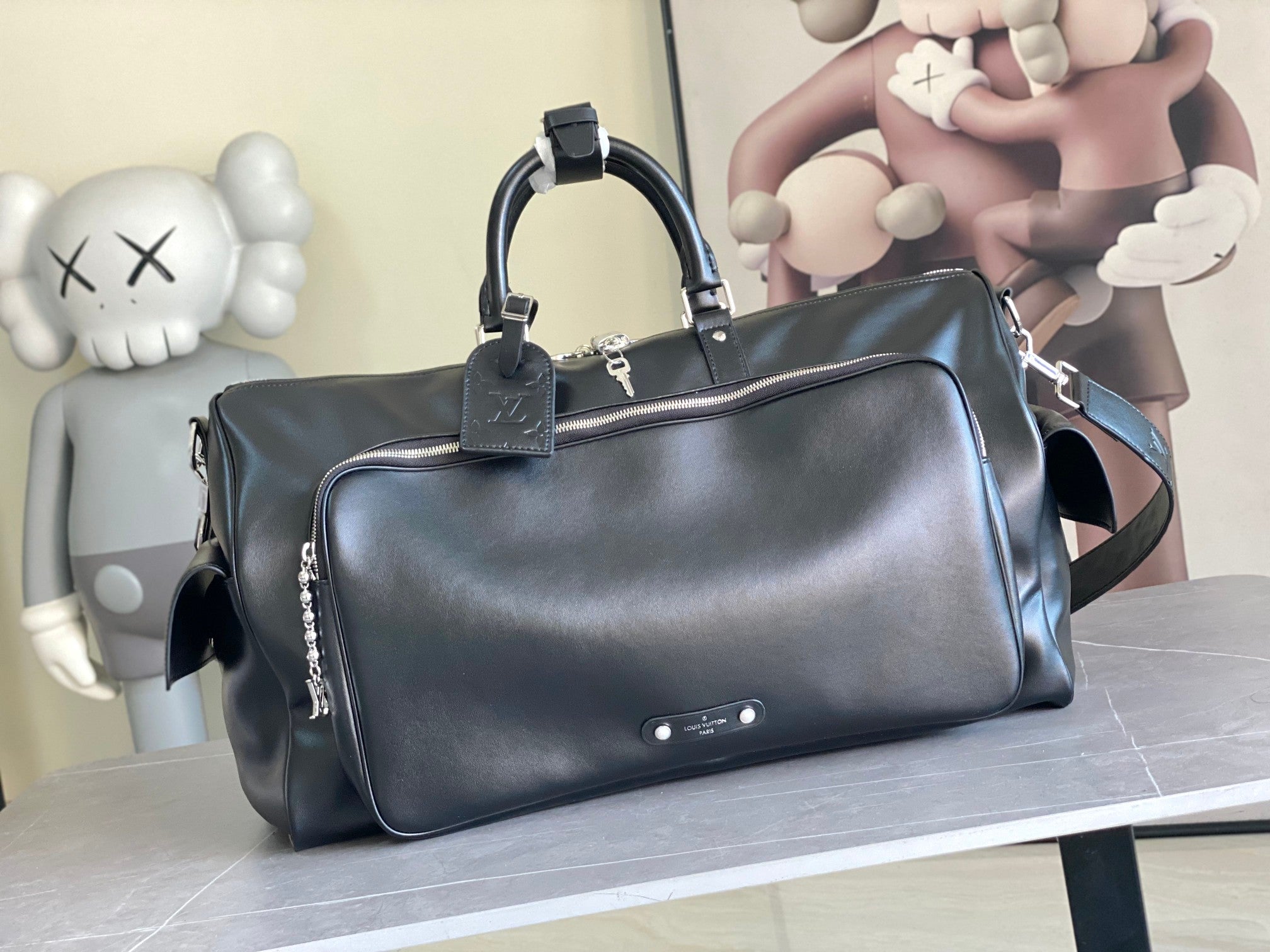 Louis Vuitton men's duffel bag with top handles and shoulder strap, dark blue leather finish
