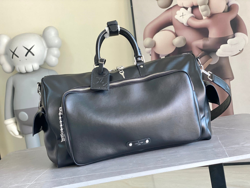 Louis Vuitton duffel bag in dark leather with top handles and front zip pocket