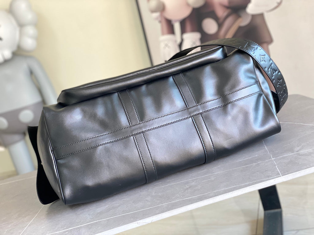 Louis Vuitton men's duffel bag with structured top, side panel stitching, dark blue leather