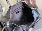 Louis Vuitton men's duffel bag open view with interior lining and small inner pocket