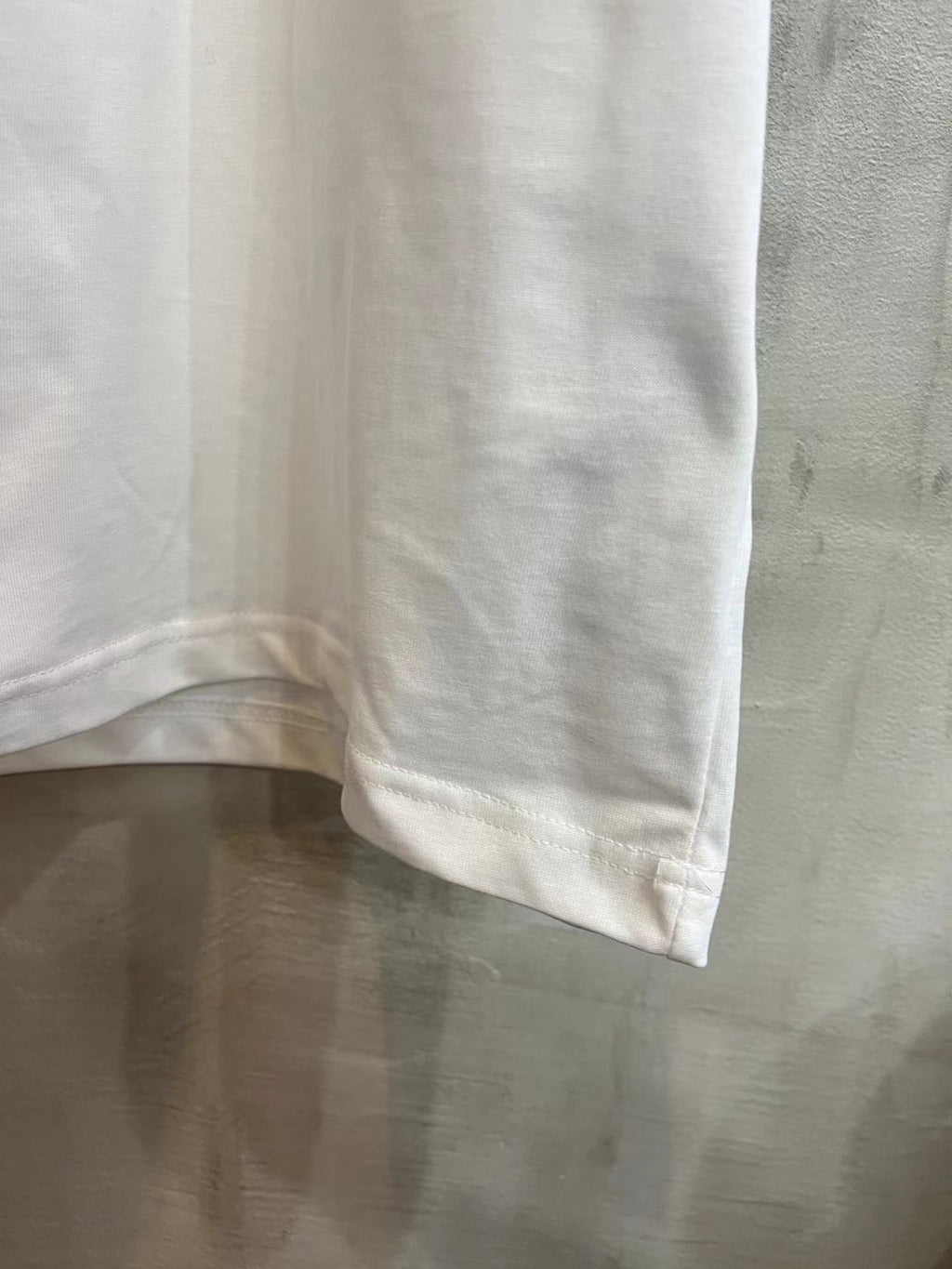 Balenciaga white T-shirt hem and lower side seam