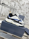 Low-top sneakers angled view, white upper with black paneling and blue stripe detail