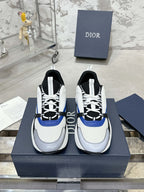 Low-top sneakers in white with black and blue accents, lace-up with textured sole
