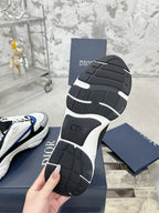Rubber outsole of low-top sneakers with CD logo and geometric tread pattern