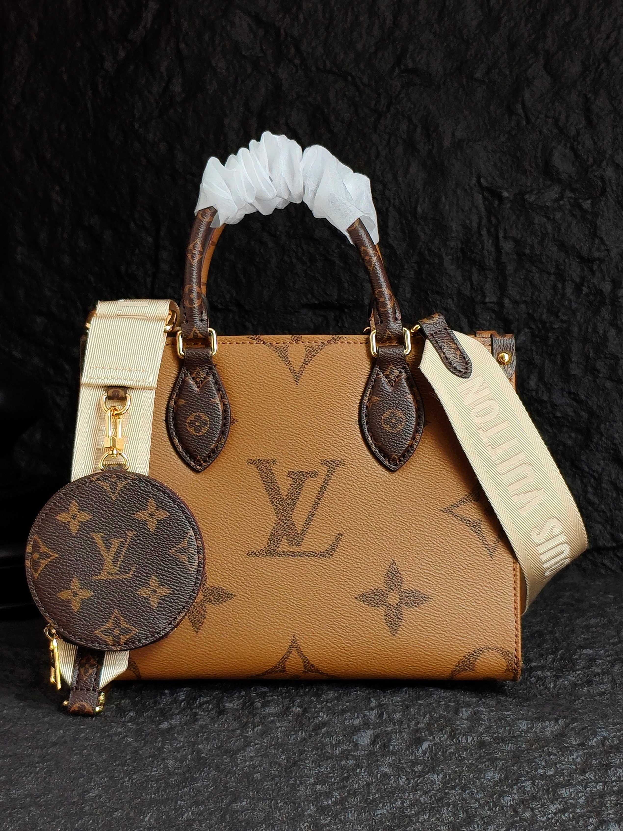 Tan monogram handbag with ribbon-wrapped handles, shoulder strap, and round pouch