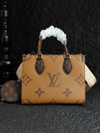 Tan monogram tote bag with ribbon top handles and front emblem detailing