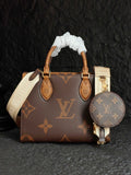 Brown monogram handbag with white ribbon top handles and leather trim