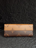 Monogram wallet with top flap and horizontal seam, beige and brown tones