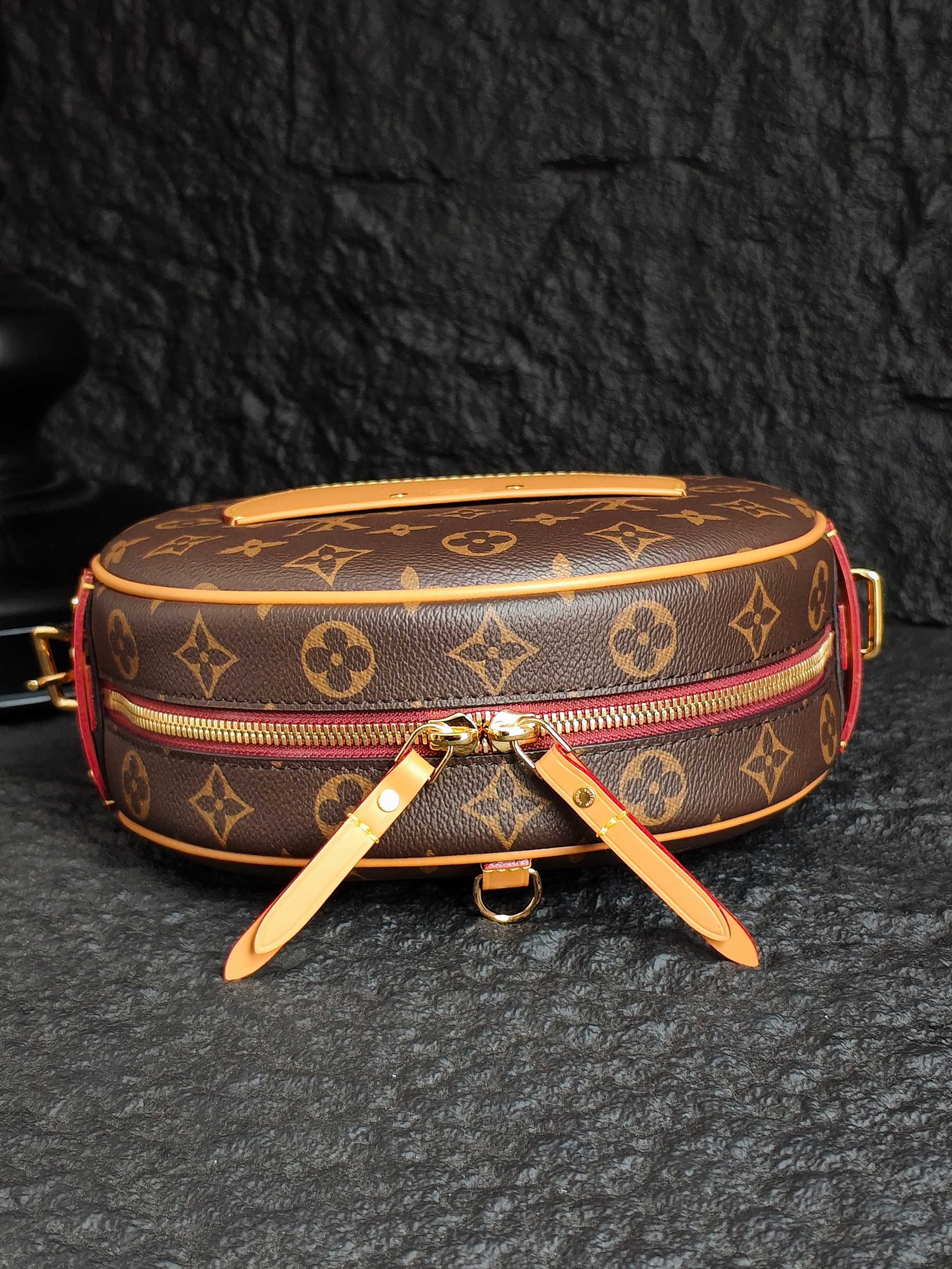 Monogram canvas crossbody bag with bow-like straps and gold front clasp