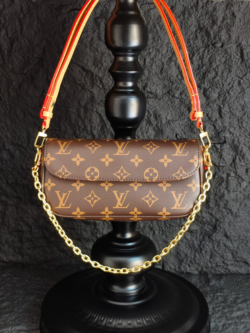 Louis Vuitton monogram shoulder bag with gold chain and red trim