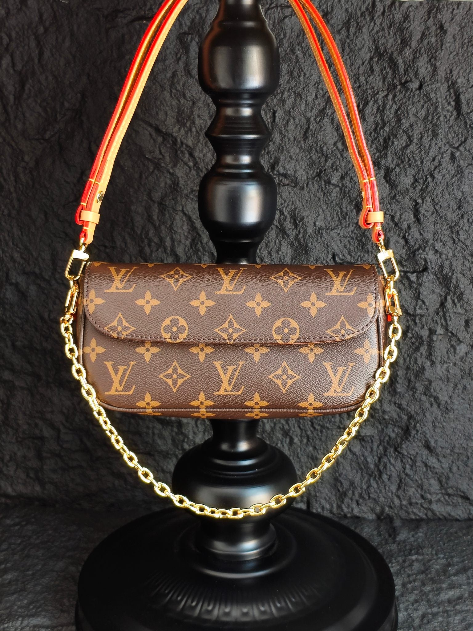 Louis Vuitton monogram shoulder bag with gold chain and red trim