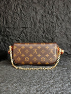 Louis Vuitton monogram flap bag with gold chain strap and tan trim