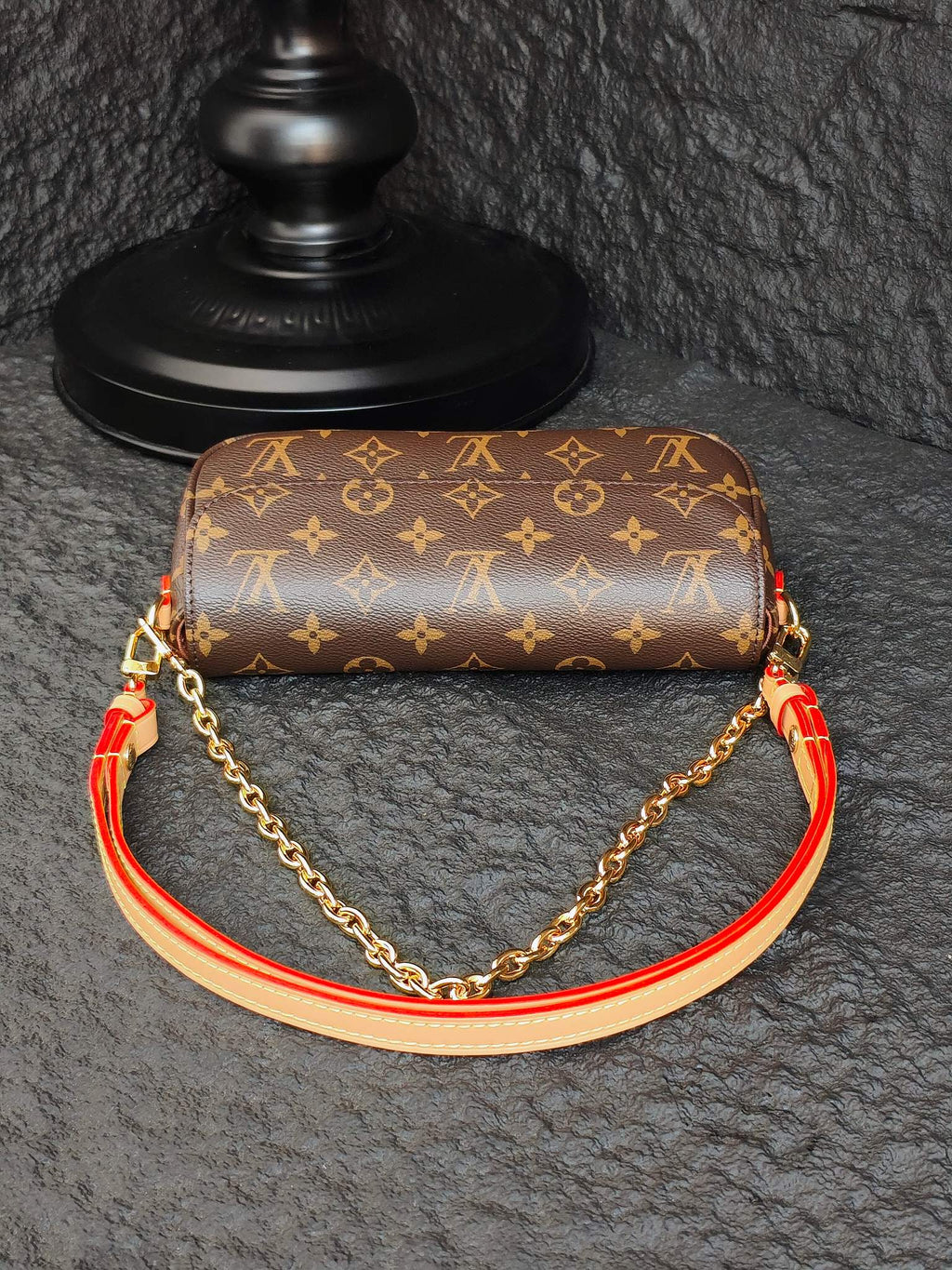 Louis Vuitton monogram shoulder bag with gold chain and orange-red piping