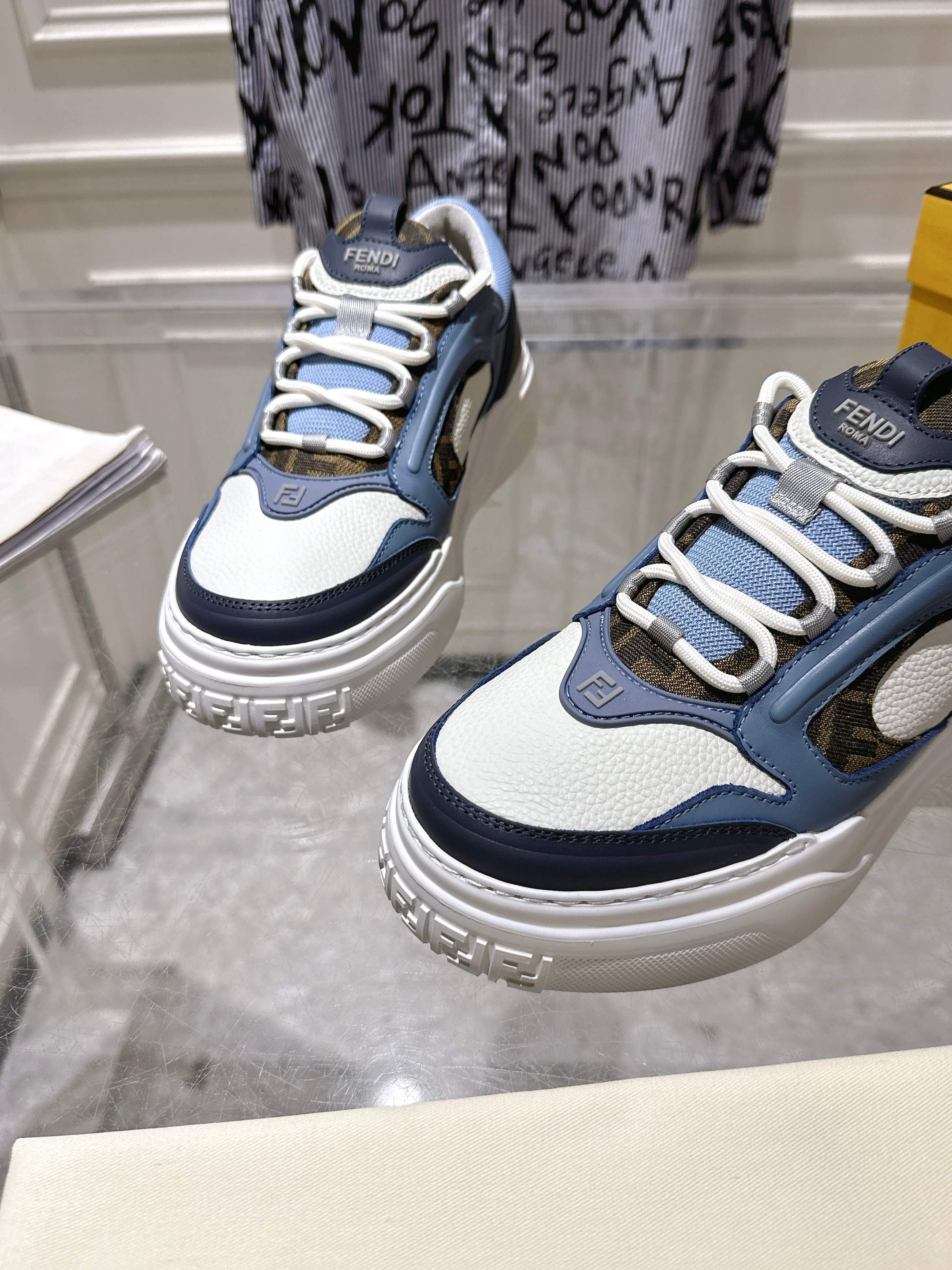 Fendi unisex sneakers, close view of lace-up front in navy, light-blue, and white