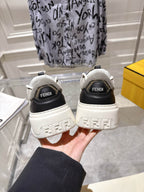 Fendi unisex sneakers from back view, white soles with black heel branding