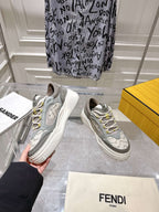 Gray and white lace-up Fendi sneakers, pair view with chunky sole