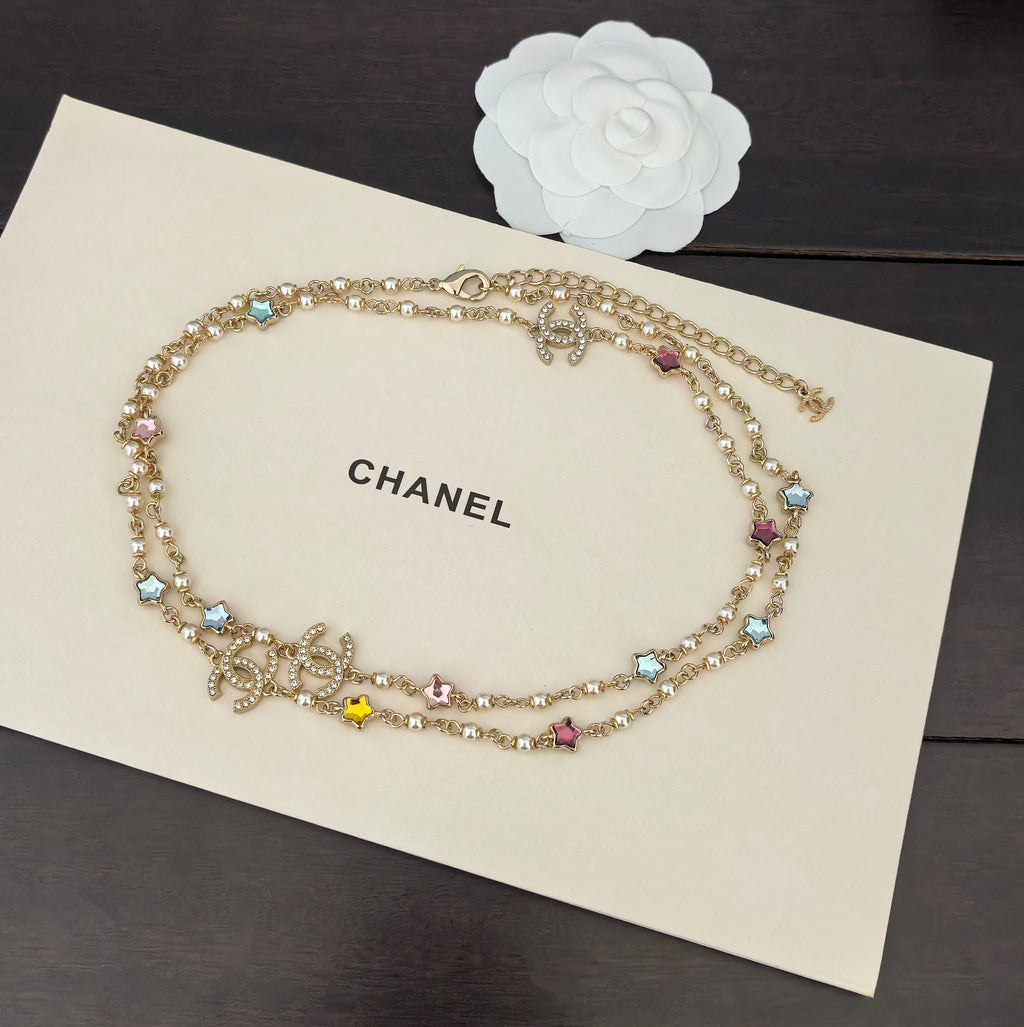 Gold-tone Chanel charm necklace with multicolor stone beads and small dangling motifs