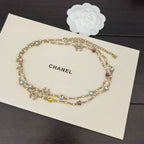Gold-tone Chanel charm necklace with multicolor stone beads and small dangling motifs