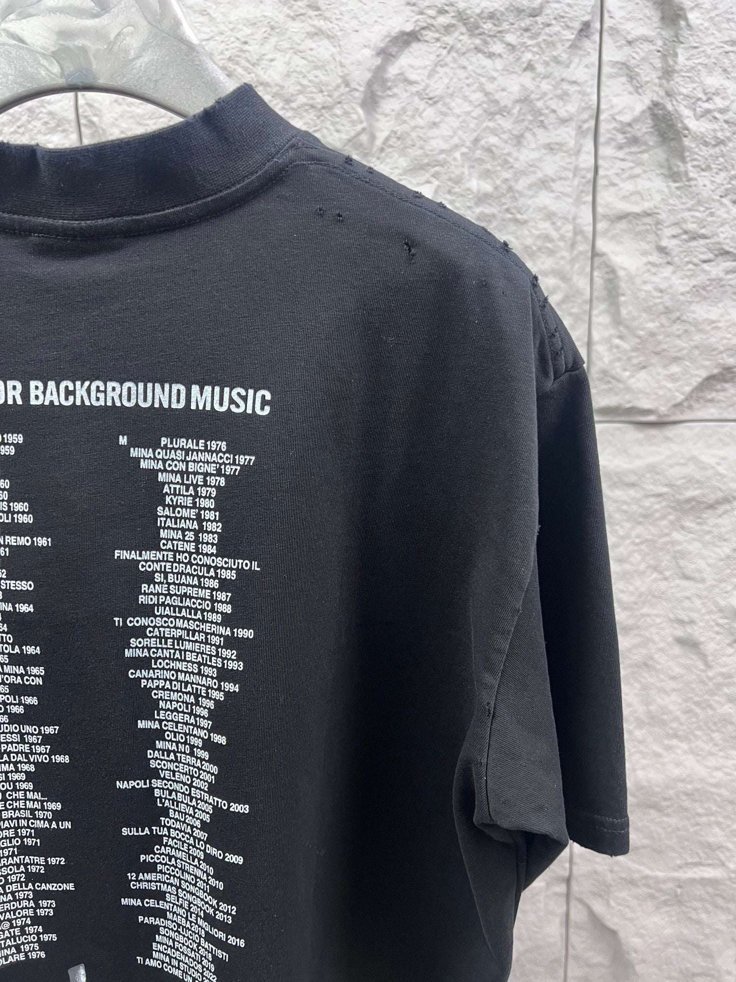 Balenciaga black T-shirt back with partial printed list text