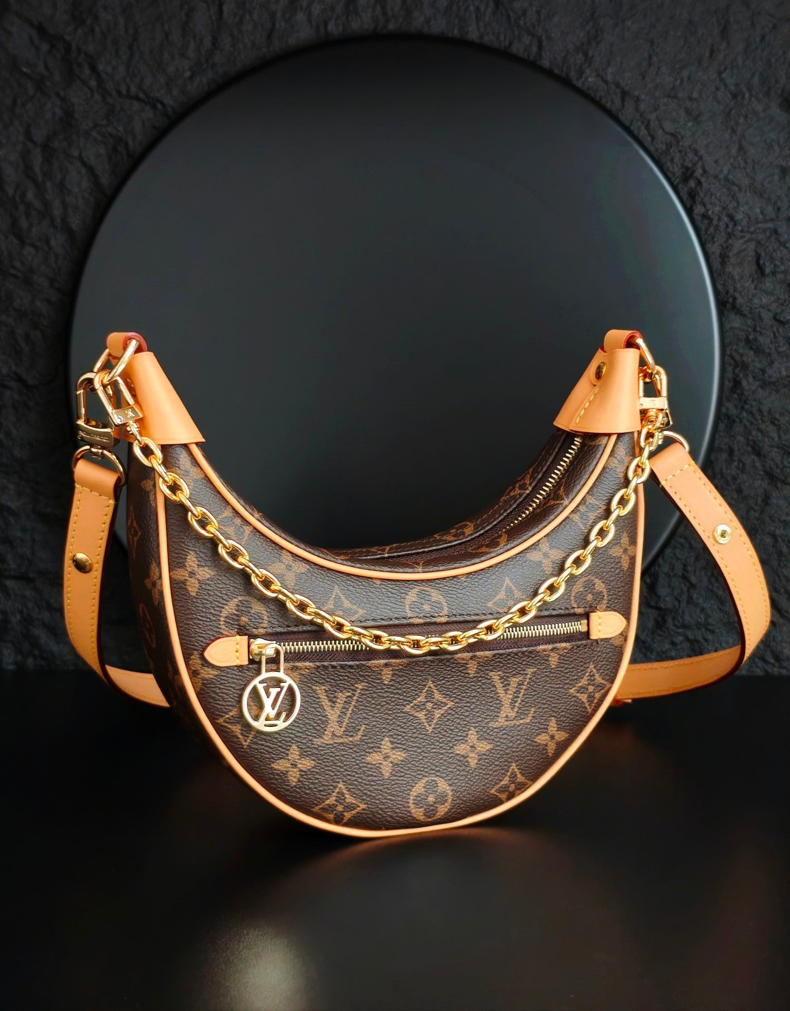 Louis Vuitton hobo bag with monogram canvas, front zip, gold chain strap and tan trim