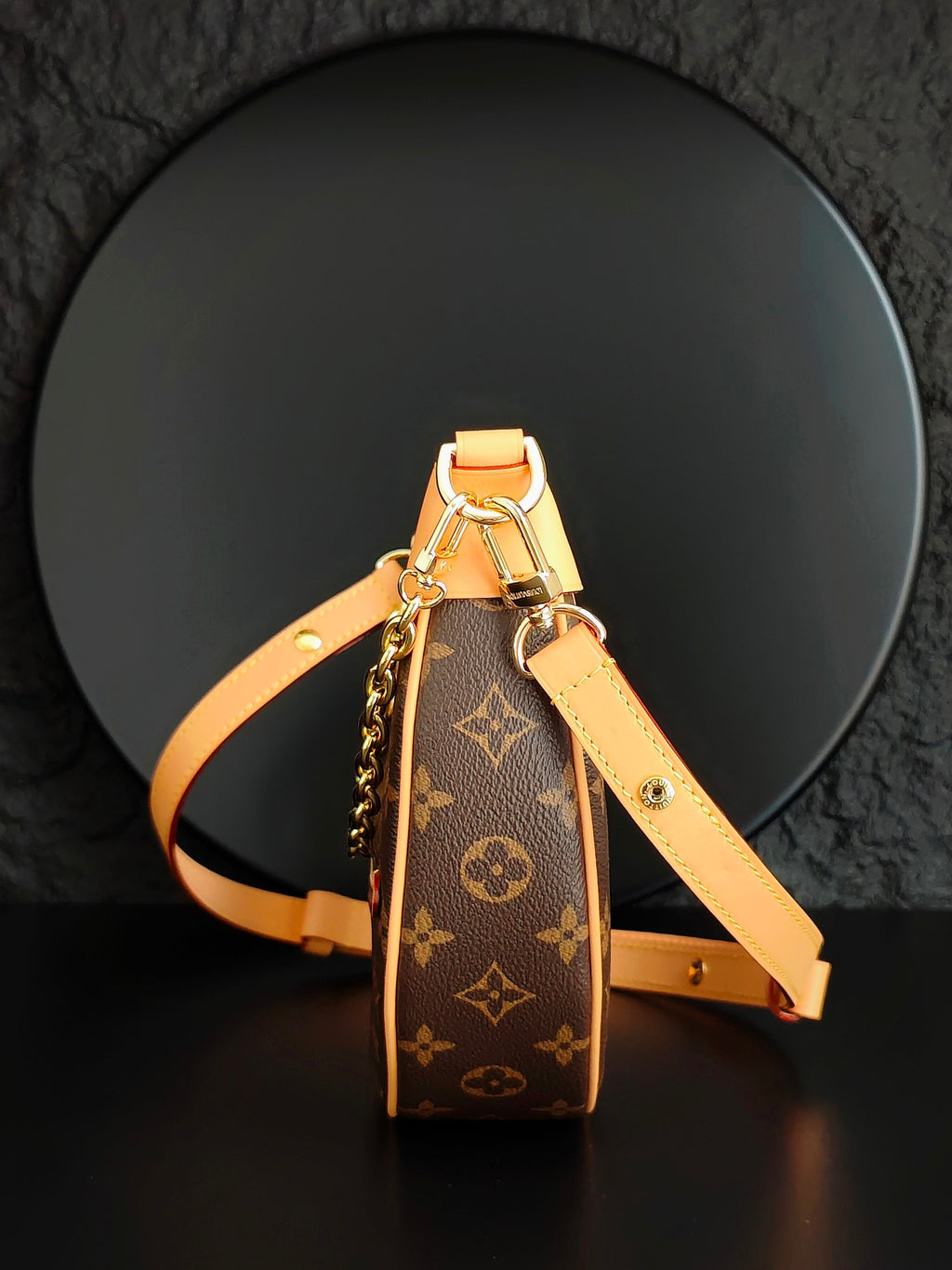 Louis Vuitton mini bag with monogram canvas, tan strap and top handle