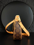 Louis Vuitton mini bag with monogram canvas, tan strap and top handle