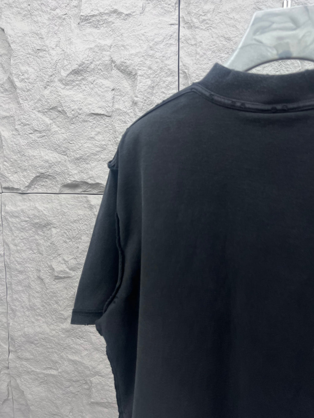 Dark T-shirt back view with short sleeves