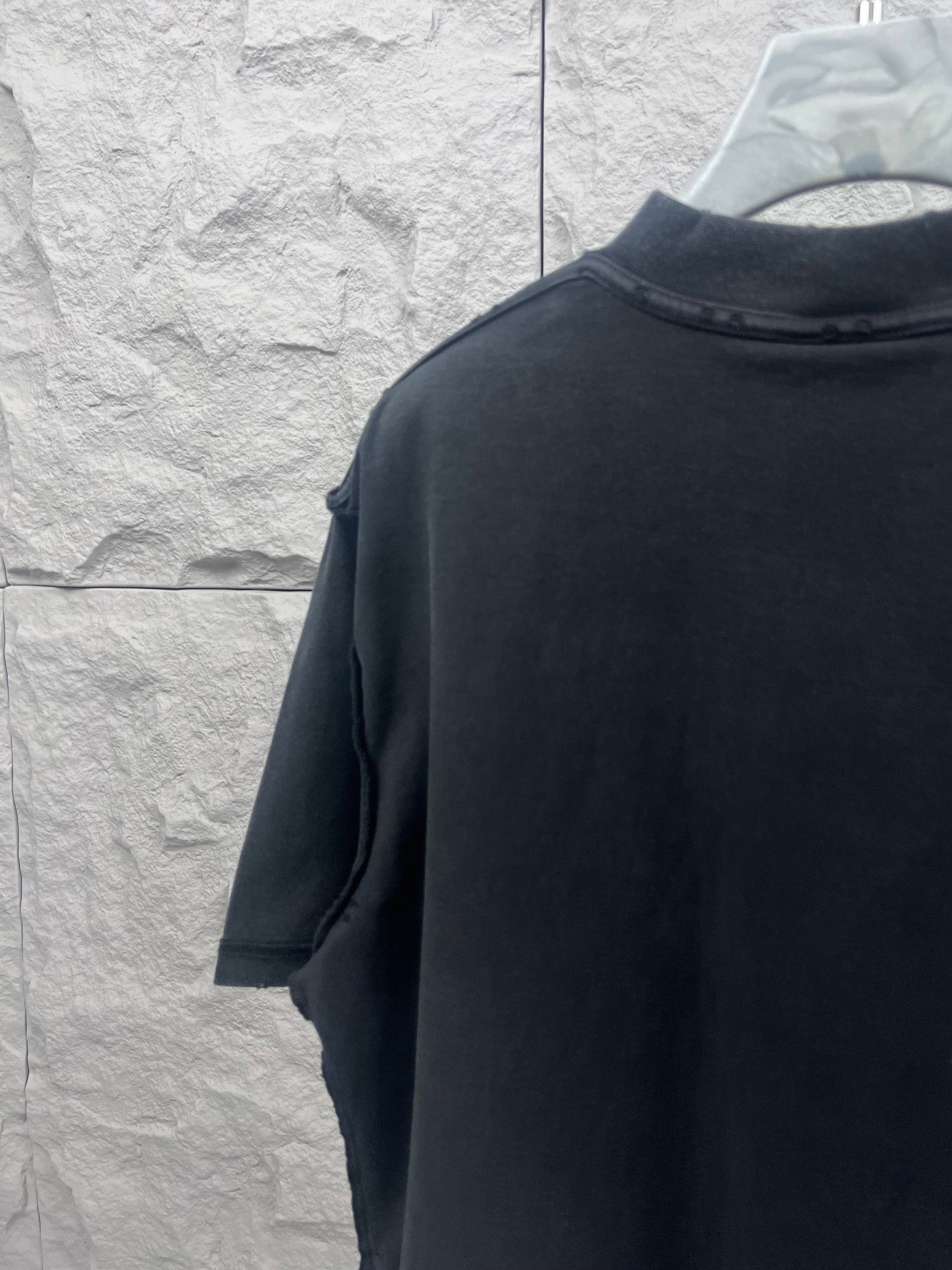 Dark T-shirt back view with short sleeves