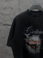 Balenciaga short-sleeve T-shirt in dark color with large front graphic print, close-up