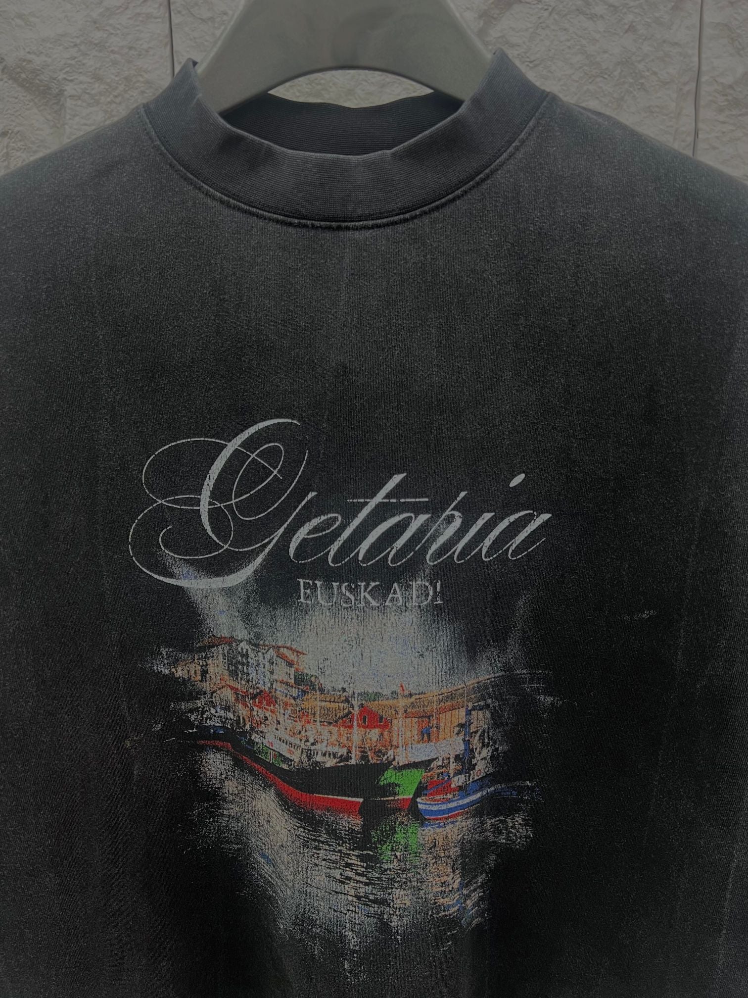 Balenciaga short-sleeve T-shirt in dark color with centered “Getaria” graphic and city scene