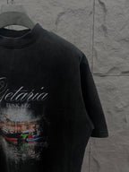 Balenciaga short-sleeve T-shirt in dark color with partial front graphic print, side angle