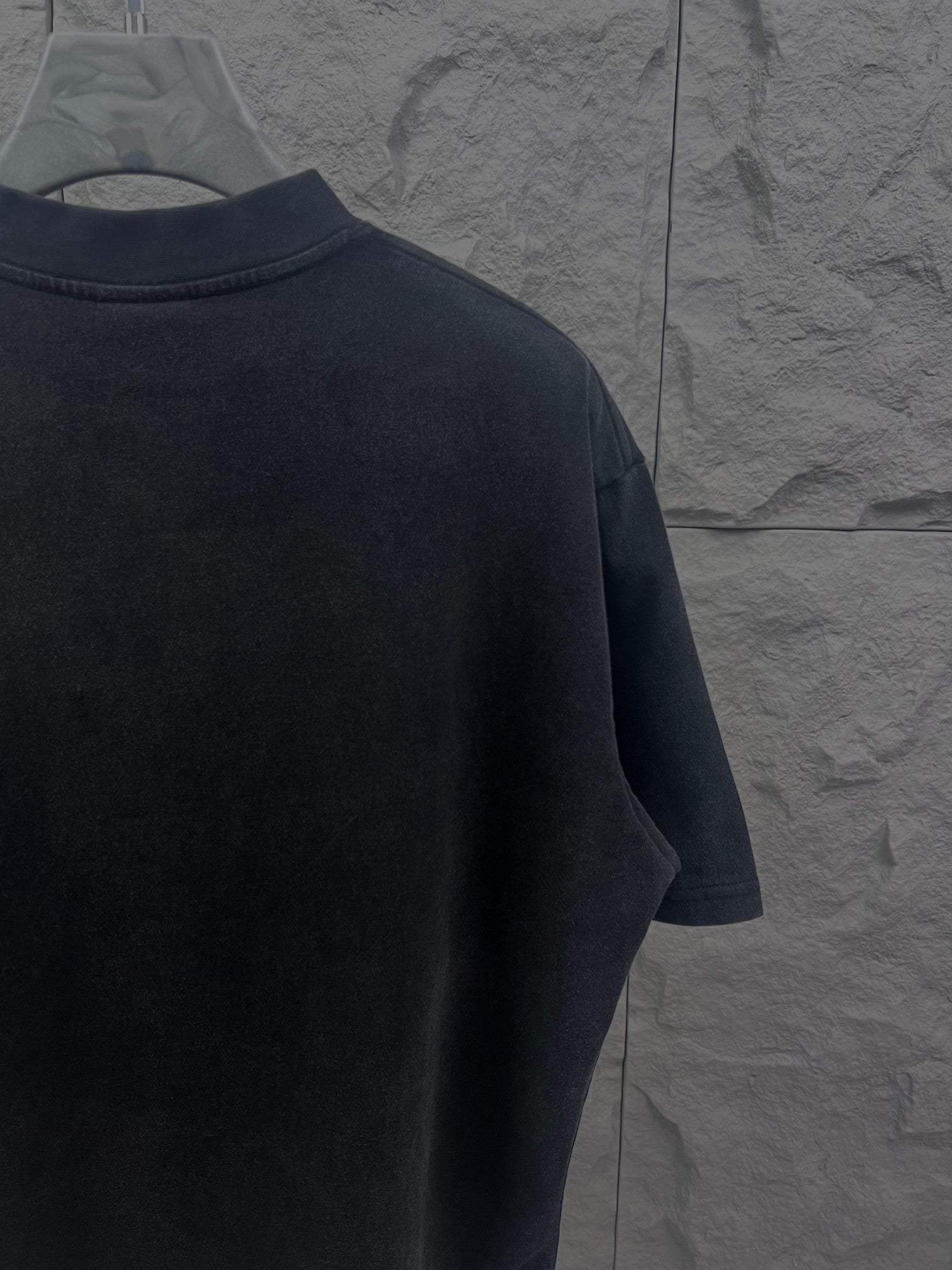 Balenciaga short-sleeve T-shirt in dark color, left side view with crew neckline