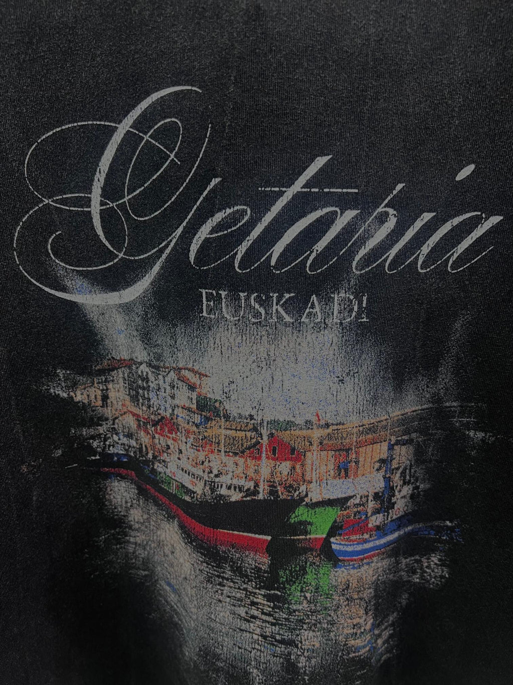 Balenciaga short-sleeve T-shirt in dark color, close-up of “Getaria” and “EUSKADI” graphic