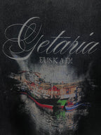 Balenciaga short-sleeve T-shirt in dark color, close-up of “Getaria” and “EUSKADI” graphic