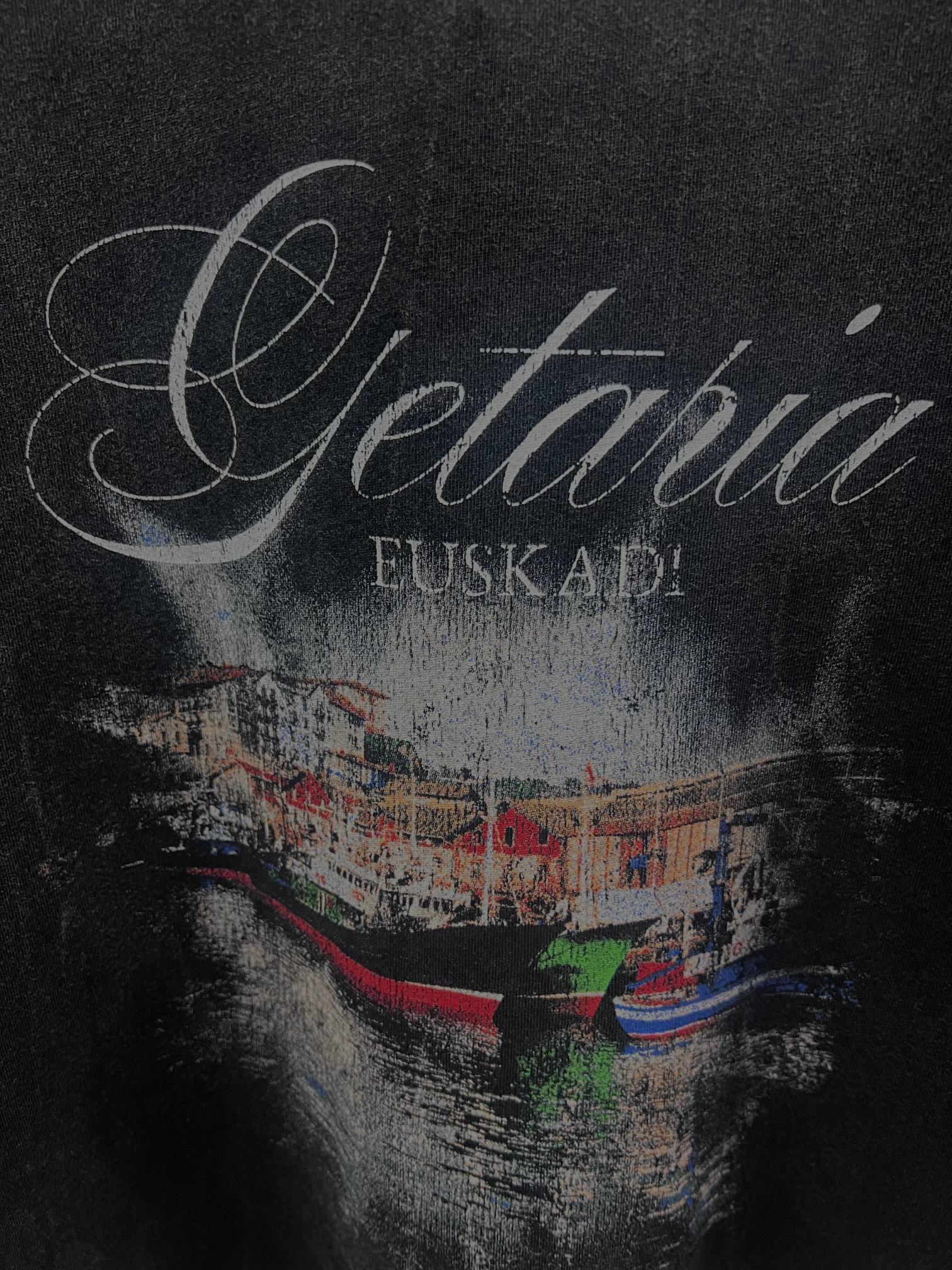 Balenciaga short-sleeve T-shirt in dark color, close-up of “Getaria” and “EUSKADI” graphic